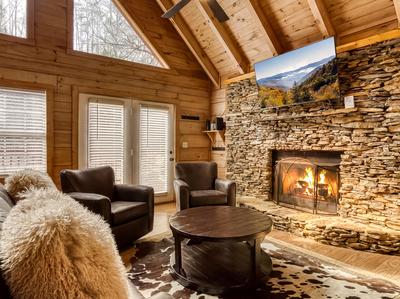 Ole Red living room with seasonal stone encase gas fireplace