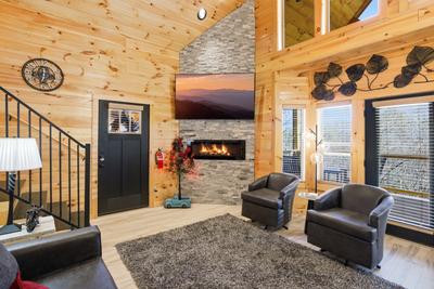 Let The Good Times Roll living room with 75 inch TV