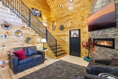 Let The Good Times Roll living room with year round electric fireplace