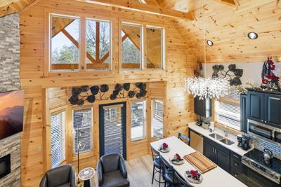 Let The Good Times Roll living room, dining area, and kitchen