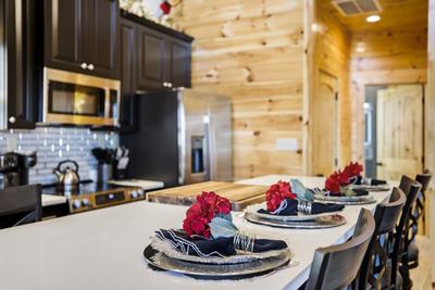 Let The Good Times Roll kitchen island and fully furnished kitchen