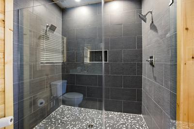 Let The Good Times Roll main level bathroom with walk in shower