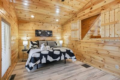 Let The Good Times Roll upper level bedroom with king size adjustable bed