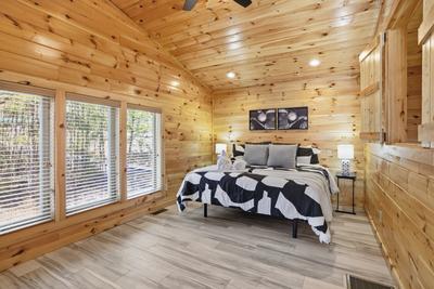 Let The Good Times Roll upper level bedroom with king size adjustable bed