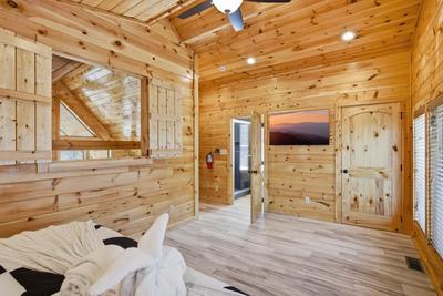 Let The Good Times Roll upper level bedroom with 50 inch TV