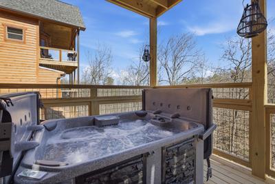 Let The Good Times Roll lower level deck with hot tub