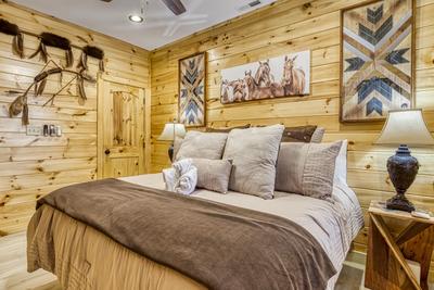 Firefly Strike Retreat main level bedroom with king size bed