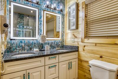 Firefly Strike Retreat main level bathroom with heated mirrors and double vanity