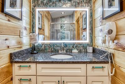 Firefly Strike Retreat upper level bathroom with heated mirror and single vanity