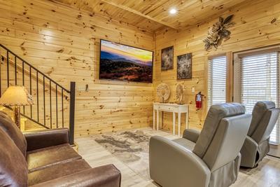 Firefly Strike Retreat lower level game room with 85 inch TV