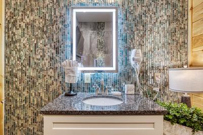 Firefly Strike Retreat lower level bathroom with heated mirror and single vanity