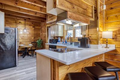 Sweet Dreams bar top, fully furnished kitchen, and dining area