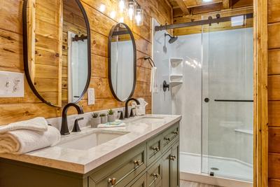 Sweet Dreams main level bathroom with double vanity and walk in shower