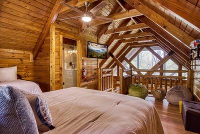 Sweet Dreams loft area with queen size bed and 50 inch TV