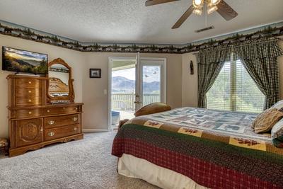Triple the Mountain View upper level bedroom one with deck access