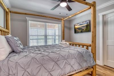 Mountain Lake Home bedroom with queen size bed and 44 inch TV