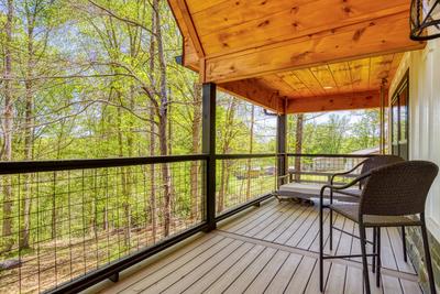 Mountain Lake Home covered back deck with cushioned swing