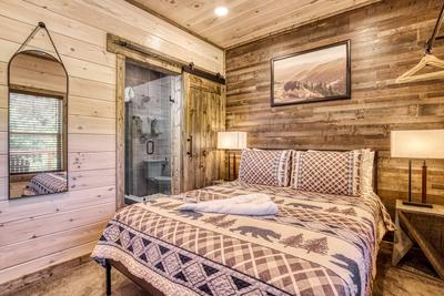 Honey Bear main level bedroom with a queen size bed and private bathroom