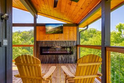 Honey Bear upper level back deck with a year round electric fireplace and a 43 inch TV