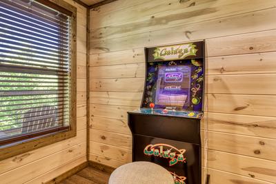 Honey Bear stand up multi-cade arcade game in lower level game room