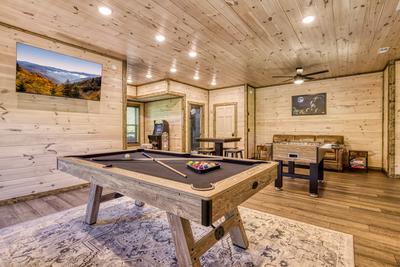 Honey Bear lower level game room with pool table, foosball table, and stand up multi-cade arcade game