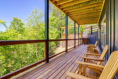 Honey Bear lower level covered wrap around deck with city and mountain views