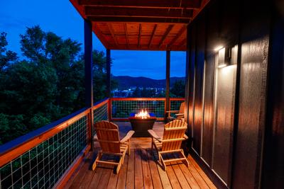 Honey Bear propane fire pit on main level wrap around deck