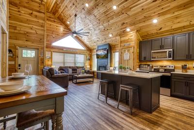 Mountain Memories dining area, fully furnished kitchen, and living room