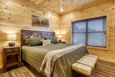 In The Clouds main level bedroom with king size bed