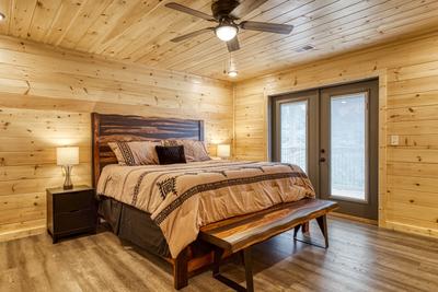 In The Clouds upper level bedroom with king size bed