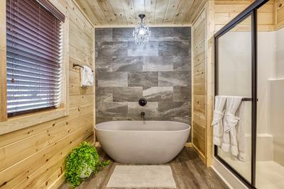 In The Clouds upper level bathroom with spa soaking tub