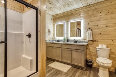 In The Clouds upper level bathroom with walk in shower and heated mirrors
