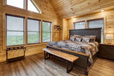 In The Clouds upper level bedroom with king size bed