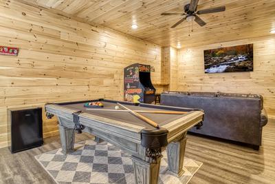In The Clouds lower level game room with pool table