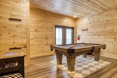 In The Clouds lower level game room with pool table
