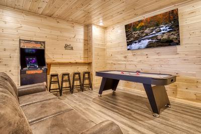 In The Clouds lower level game room with air hockey table
