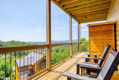 In The Clouds lower level deck with mountain views