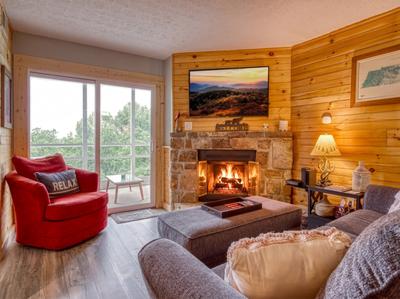 Ober the Rainbow living room with stone encase fireplace