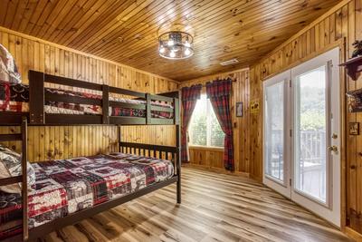 Triple the Mountain View lower level bedroom with queen over queen bunk beds