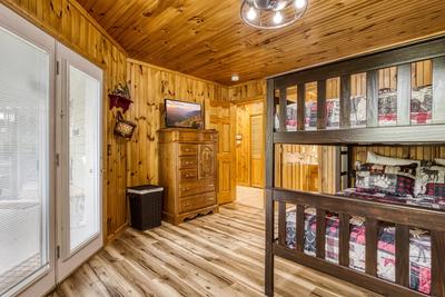 Triple the Mountain View lower level bedroom with queen over queen bunk beds