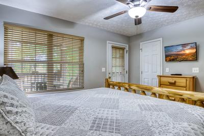 Lee's Creekside main level bedroom with king size bed and 32 inch TV