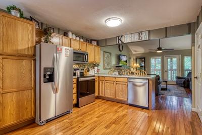 Whispering River fully furnished kitchen and living room