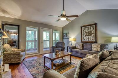 Whispering River living room with deck access