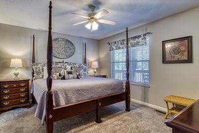 Whispering River main level bedroom with king size bed