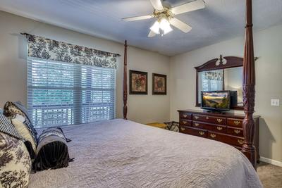 Whispering River king size bed in main level bedroom