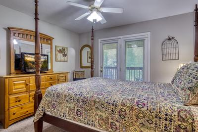 Whispering River queen size bed in main level bedroom two