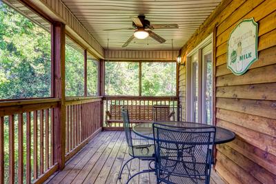 Whispering River main level screened in back deck