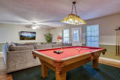 Whispering River lower level game room with pool table