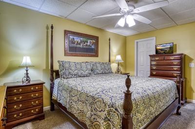 Whispering River lower level bedroom with king size bed