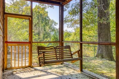 Whispering River swing on lower level patio